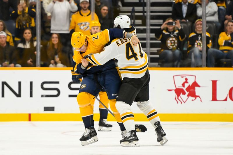 Oct 22, 2024; Nashville, Tennessee, USA;  Nashville Predators defenseman Luke Schenn (2) and Boston Bruins center Mark Kastelic (47) exchange blows during the first period at Bridgestone Arena. Mandatory Credit: Steve Roberts-Imagn Images