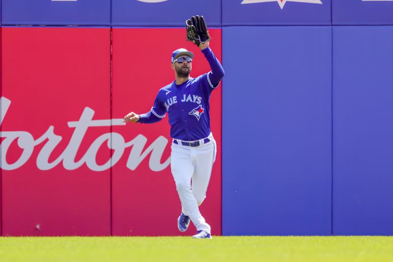 Feb 28, 2023; Dunedin, Florida, USA; Toronto Blue Jays center fielder Kevin Kiermaier (39) catches a fly ball during the first inning against the Detroit Tigers at TD Ballpark. Mandatory Credit: Mike Watters-USA TODAY Sports