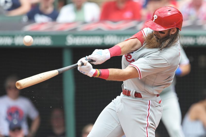 Jul 23, 2023; Cleveland, Ohio, USA; Philadelphia Phillies center fielder Brandon Marsh (16) hits an RBI single during the sixth inning against the Cleveland Guardians at Progressive Field. Mandatory Credit: Ken Blaze-USA TODAY Sports