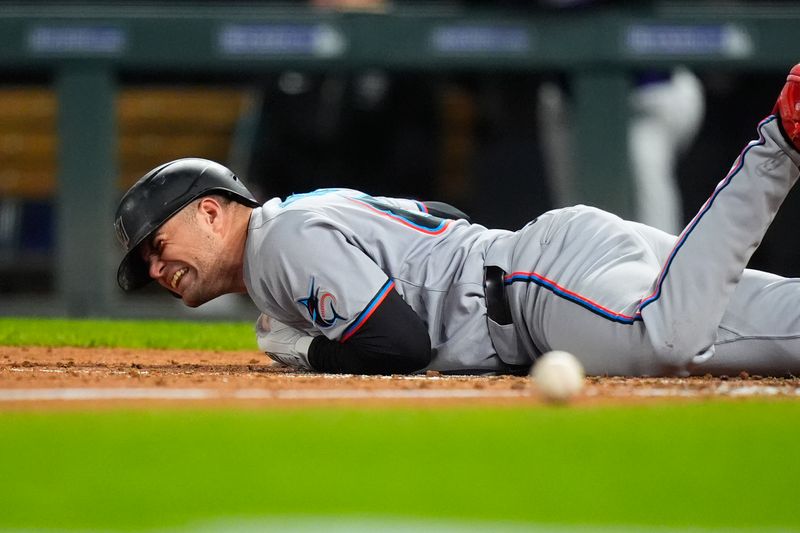 Sep 17, 2025; Denver, Colorado, USA; Miami Marlins center tfielder Jakob Marsee (87) reacts after being hit by a baseball in the sixth inning against the Colorado Rockies at Coors Field. Mandatory Credit: Ron Chenoy-Imagn Images
