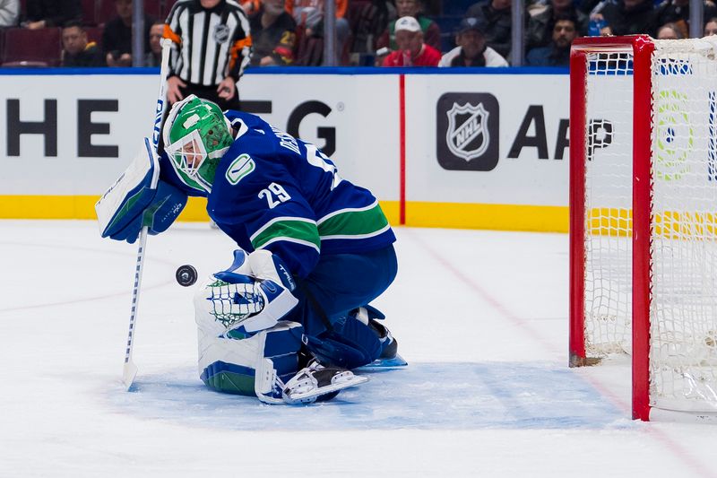 Dec 28, 2023; Vancouver, British Columbia, CAN; Vancouver Canucks goalie Casey DeSmith (29) makes a save against the Philadelphia Flyers in the first period at Rogers Arena. Mandatory Credit: Bob Frid-USA TODAY Sports