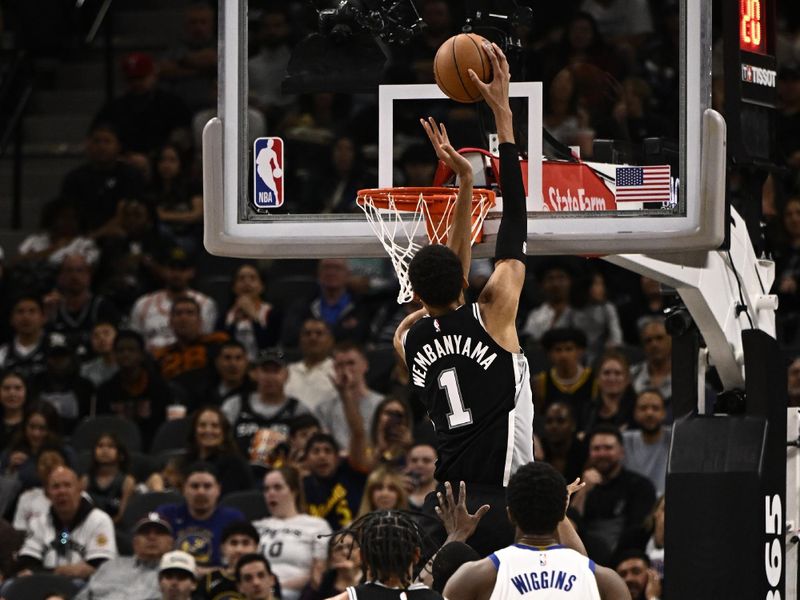 SAN ANTONIO, TX - MARCH 11: Victor Wembanyama #1 of the San Antonio Spurs drives to the basket during the game against the Golden State Warriors on March 11, 2024 at the AT&T Center in San Antonio, Texas. NOTE TO USER: User expressly acknowledges and agrees that, by downloading and or using this photograph, user is consenting to the terms and conditions of the Getty Images License Agreement. Mandatory Copyright Notice: Copyright 2024 NBAE (Photos by David Dow/NBAE via Getty Images)