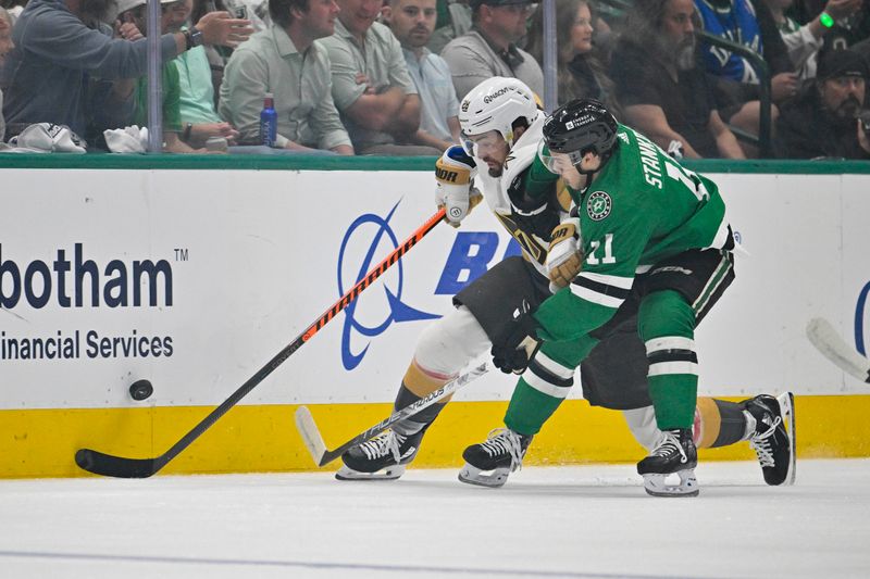 May 5, 2024; Dallas, Texas, USA; Vegas Golden Knights left wing William Carrier (28) and Dallas Stars center Logan Stankoven (11) chase the puck during the first period in game seven of the first round of the 2024 Stanley Cup Playoffs at American Airlines Center. Mandatory Credit: Jerome Miron-USA TODAY Sports