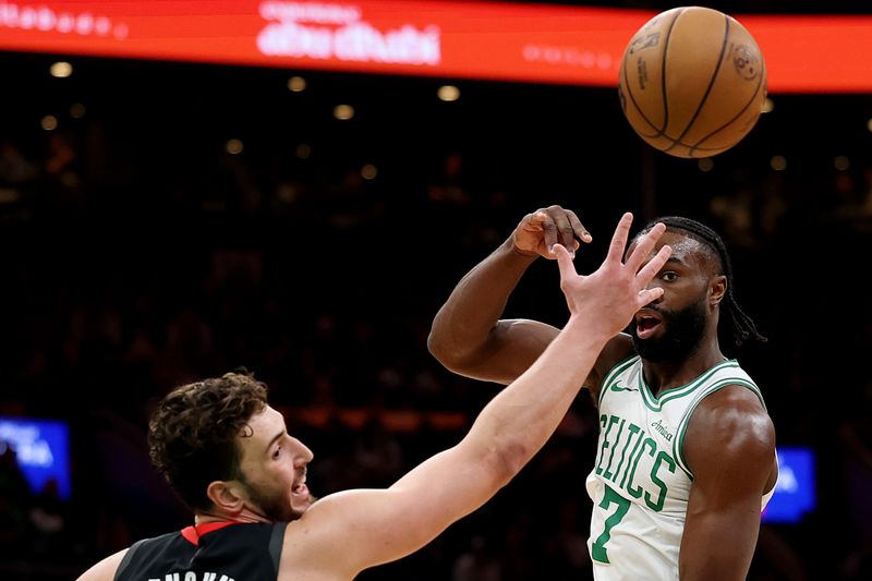 BOSTON, MASSACHUSETTS - JANUARY 27: Jaylen Brown #7 of the Boston Celtics makes a pass against Alperen Sengun #28 of the Houston Rockets during the first quarter at TD Garden on January 27, 2025 in Boston, Massachusetts. NOTE TO USER: User expressly acknowledges and agrees that, by downloading and or using this photograph, User is consenting to the terms and conditions of the Getty Images License Agreement.  (Photo by Maddie Meyer/Getty Images)