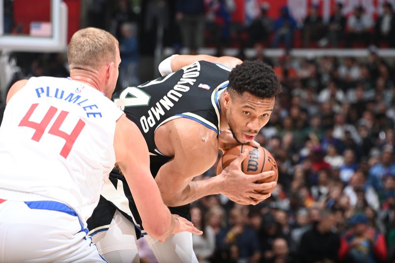 LOS ANGELES, CA - MARCH 10: Giannis Antetokounmpo #34 of the Milwaukee Bucks looks to pass the ball during the game against the LA Clippers on March 10, 2024 at Crypto.Com Arena in Los Angeles, California. NOTE TO USER: User expressly acknowledges and agrees that, by downloading and/or using this Photograph, user is consenting to the terms and conditions of the Getty Images License Agreement. Mandatory Copyright Notice: Copyright 2024 NBAE (Photo by Andrew D. Bernstein/NBAE via Getty Images)