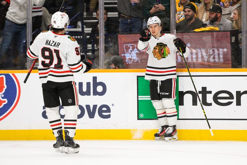 Jan 16, 2025; Nashville, Tennessee, USA;  Chicago Blackhawks center Connor Bedard (98) celebrates his goal with center Frank Nazar (91) against the Nashville Predators during the second period at Bridgestone Arena. Mandatory Credit: Steve Roberts-Imagn Images