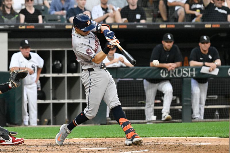 Jun 19, 2024; Chicago, Illinois, USA;  Houston Astros outfielder Mauricio Dubón (14) grounds in to a force out during the third inning against the Chicago White Sox at Guaranteed Rate Field. Mandatory Credit: Matt Marton-USA TODAY Sports