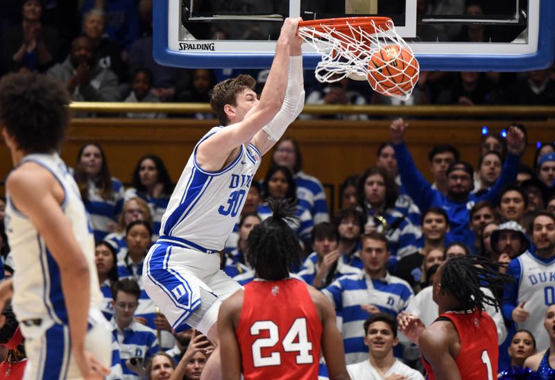 Feb 20, 2023; Durham, North Carolina, USA; Duke Blue Devils center Kyle Filipowski(30) dunks during the first half against the Louisville Cardinals at Cameron Indoor Stadium. Mandatory Credit: Rob Kinnan-USA TODAY Sports