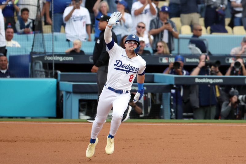 Oct 11, 2024; Los Angeles, California, USA; Los Angeles Dodgers third baseman Enrique Hernandez (8) runs after hitting a solo home run in the second inning against the San Diego Padres during game five of the NLDS for the 2024 MLB Playoffs at Dodger Stadium. Mandatory Credit: Kiyoshi Mio-Imagn Images
