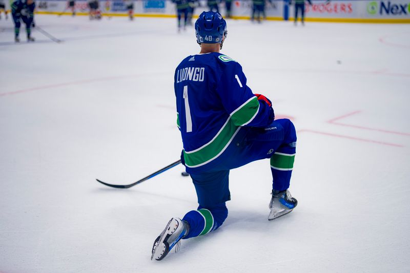 Dec 14, 2023; Vancouver, British Columbia, CAN; Vancouver Canucks forward Elias Pettersson (40) warms up wearing Roberto Luongo   s number 1 jersey prior to an on ice presentation before a game against the Florida Panthers the Canucks celebrate and honour the career of former Vancouver goalie Roberto Luongo. There will be a ceremony for Luongo inducting him into the Vancouver Canucks Ring of Honour at Rogers Arena. Mandatory Credit: Bob Frid-USA TODAY Sports