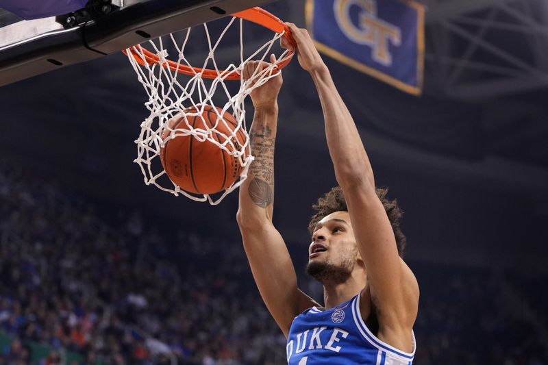 Mar 11, 2023; Greensboro, NC, USA;  Duke Blue Devils center Dereck Lively II (1) scores in the first half of the Championship of the ACC Tournament at Greensboro Coliseum. Mandatory Credit: Bob Donnan-USA TODAY Sports