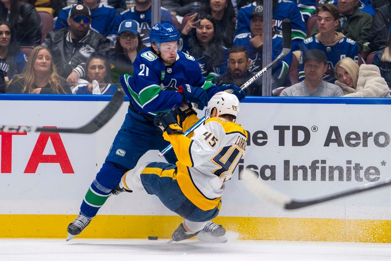 Apr 30, 2024; Vancouver, British Columbia, CAN; Vancouver Canucks forward Nils Hoglander (21) checks Nashville Predators defenseman Alexandre Carrier (45) during the first period in game five of the first round of the 2024 Stanley Cup Playoffs at Rogers Arena. Mandatory Credit: Bob Frid-USA TODAY Sports