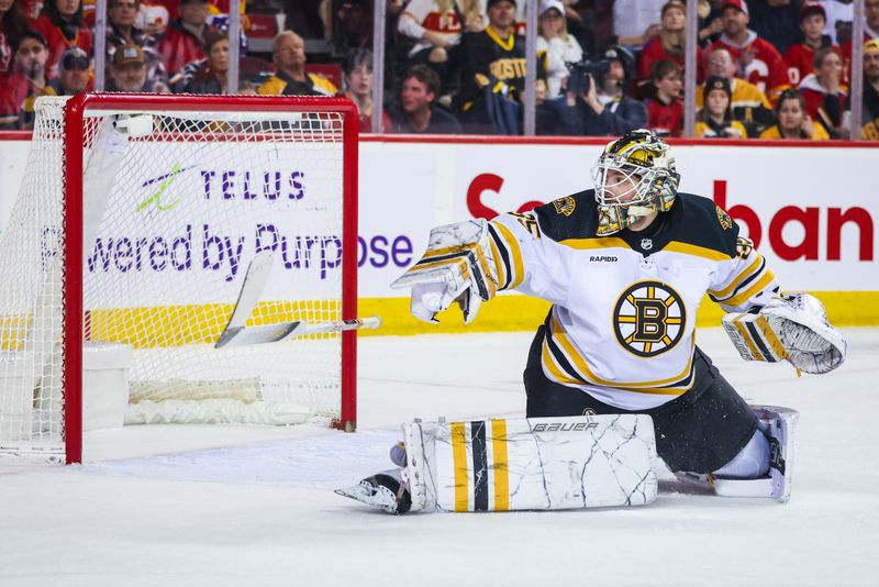 Feb 28, 2023; Calgary, Alberta, CAN; Boston Bruins goaltender Linus Ullmark (35) makes a save against the Calgary Flames during the overtime period at Scotiabank Saddledome. Mandatory Credit: Sergei Belski-USA TODAY Sports