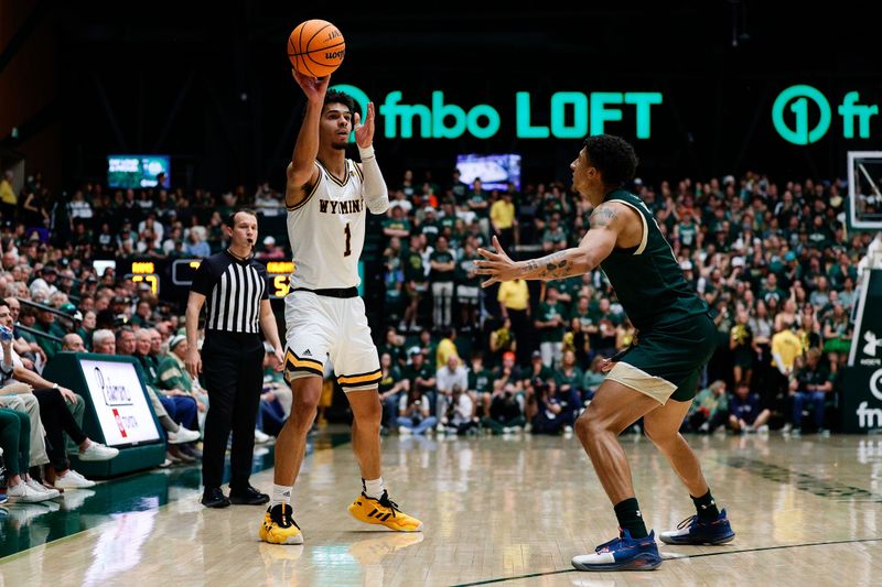 Mar 2, 2024; Fort Collins, Colorado, USA; Wyoming Cowboys guard Brendan Wenzel (1) passes the ball as Colorado State Rams guard Nique Clifford (10) defends in the second half at Moby Arena. Mandatory Credit: Isaiah J. Downing-USA TODAY Sports