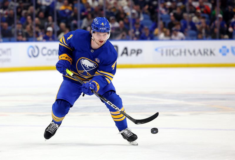 Mar 14, 2024; Buffalo, New York, USA;  Buffalo Sabres defenseman Bowen Byram (4) makes a pass during the second period against the New York Islanders at KeyBank Center. Mandatory Credit: Timothy T. Ludwig-USA TODAY Sports