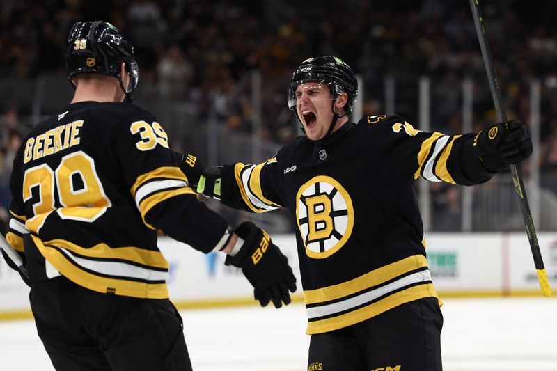 Nov 28, 2025; Boston, Massachusetts, USA; Boston Bruins defenseman Henri Jokiharju (20) celebrates a goal by center Morgan Geekie (39) during the third period against the New York Rangers at TD Garden. Mandatory Credit: Winslow Townson-Imagn Images
