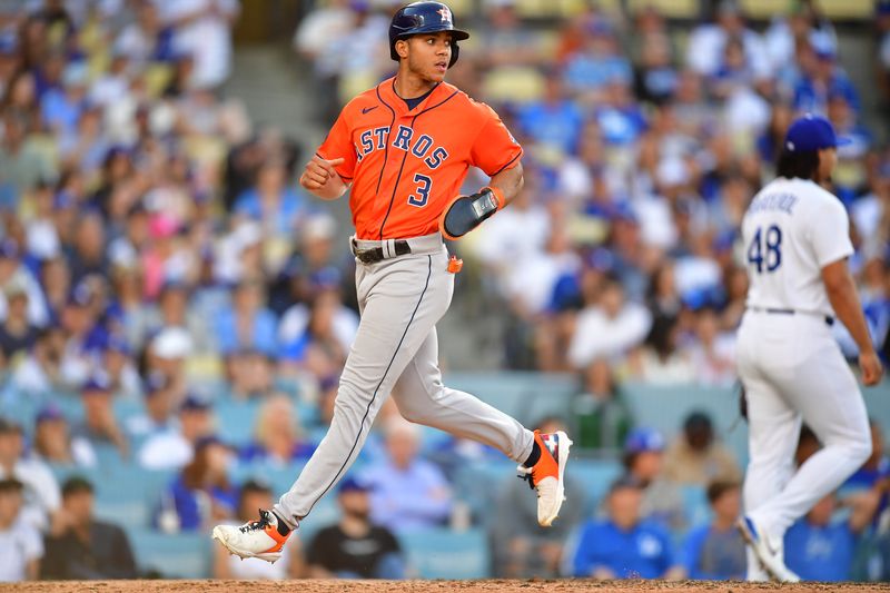 Jun 25, 2023; Los Angeles, California, USA; Houston Astros shortstop Jeremy Pena (3) scores a run on an error committed by the Los Angeles Dodgers during the tenth inning at Dodger Stadium. Mandatory Credit: Gary A. Vasquez-USA TODAY Sports