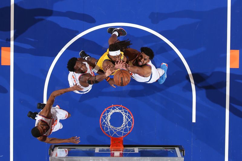 NEW YORK, NY - OCTOBER 25: OG Anunoby #8, Karl-Anthony Towns #32, and Isaiah Jackson #22 of the Indiana Pacers go up for the rebound during the game of the New York Knicks  on October 25, 2024 at Madison Square Garden in New York City, New York.  NOTE TO USER: User expressly acknowledges and agrees that, by downloading and or using this photograph, User is consenting to the terms and conditions of the Getty Images License Agreement. Mandatory Copyright Notice: Copyright 2024 NBAE  (Photo by David L. Nemec/NBAE via Getty Images)