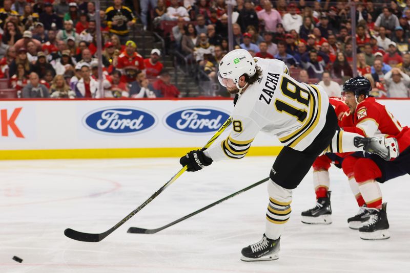 May 14, 2024; Sunrise, Florida, USA; Boston Bruins center Pavel Zacha (18) shoots the puck against the Florida Panthers during the third period in game five of the second round of the 2024 Stanley Cup Playoffs at Amerant Bank Arena. Mandatory Credit: Sam Navarro-USA TODAY Sports