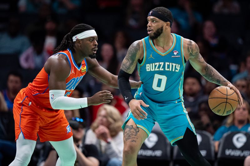 CHARLOTTE, NORTH CAROLINA - APRIL 07: Luguentz Dort #5 of the Oklahoma City Thunder guards Miles Bridges #0 of the Charlotte Hornets in the third quarter during their game at Spectrum Center on April 07, 2024 in Charlotte, North Carolina. NOTE TO USER: User expressly acknowledges and agrees that, by downloading and or using this photograph, User is consenting to the terms and conditions of the Getty Images License Agreement. (Photo by Jacob Kupferman/Getty Images)