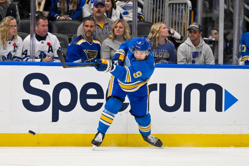 Nov 2, 2024; St. Louis, Missouri, USA;  St. Louis Blues center Alexandre Texier (9) shoots against the Toronto Maple Leafs during the second period at Enterprise Center. Mandatory Credit: Jeff Curry-Imagn Images