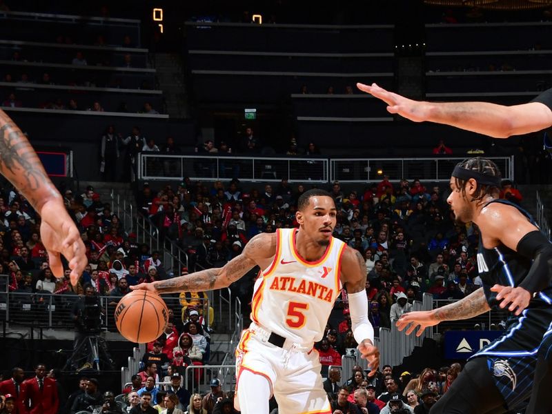 ATLANTA, GA - JANUARY 17: Dejounte Murray #5 of the Atlanta Hawks goes to the basket during the game on January 17, 2024 at State Farm Arena in Atlanta, Georgia.  NOTE TO USER: User expressly acknowledges and agrees that, by downloading and/or using this Photograph, user is consenting to the terms and conditions of the Getty Images License Agreement. Mandatory Copyright Notice: Copyright 2024 NBAE (Photo by Scott Cunningham/NBAE via Getty Images)