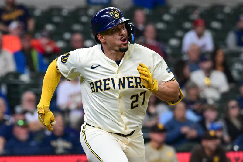 Apr 17, 2024; Milwaukee, Wisconsin, USA;  Milwaukee Brewers shortstop Willy Adames (27) runs after hitting a single to break up a no-hitter in the in the seventh inning against the San Diego Padres at American Family Field. Mandatory Credit: Benny Sieu-USA TODAY Sports