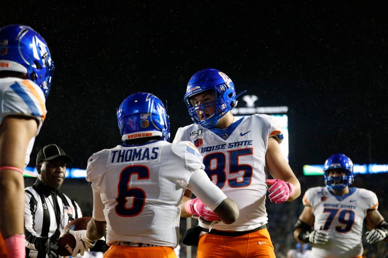 Oct 19, 2019; Provo, UT, USA; Boise State Broncos wide receiver CT Thomas (6) celebrates with tight end John Bates (85) after scoring a touchdown against the Brigham Young Cougars in the first quarter at LaVell Edwards Stadium. Mandatory Credit: Gabe Mayberry-USA TODAY Sports