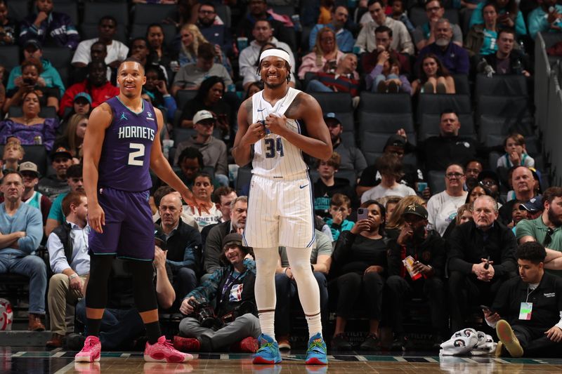 CHARLOTTE, NC - MARCH 5: Grant Williams #2 of the Charlotte Hornets and Wendell Carter Jr. #34 of the Orlando Magic look on during the game on March 5, 2024 at Spectrum Center in Charlotte, North Carolina. NOTE TO USER: User expressly acknowledges and agrees that, by downloading and or using this photograph, User is consenting to the terms and conditions of the Getty Images License Agreement. Mandatory Copyright Notice: Copyright 2024 NBAE (Photo by Kent Smith/NBAE via Getty Images)