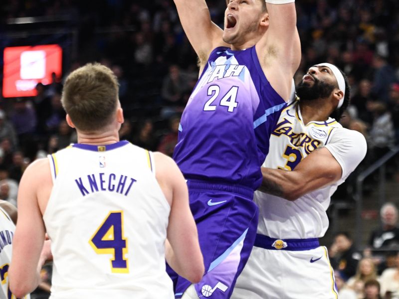 SALT LAKE CITY, UTAH - DECEMBER 01: Walker Kessler #24 of the Utah Jazz dunks over Anthony Davis #3 of the Los Angeles Lakers during the second half at Delta Center on December 01, 2024 in Salt Lake City, Utah. NOTE TO USER: User expressly acknowledges and agrees that, by downloading and or using this photograph, User is consenting to the terms and conditions of the Getty Images License Agreement. (Photo by Alex Goodlett/Getty Images)