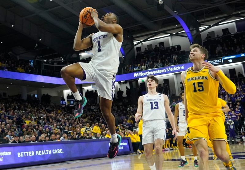 Feb 2, 2023; Evanston, Illinois, USA; Northwestern Wildcats guard Chase Audige (1) drives to the basket against the Michigan Wolverines during the second half at Welsh-Ryan Arena. Mandatory Credit: David Banks-USA TODAY Sports