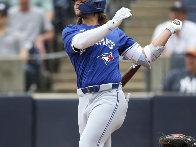 Mar 16, 2024; Tampa, Florida, USA;  Toronto Blue Jays shortstop Bo Bichette (11) hits a two-run home run against the New York Yankees in the sixth inning at George M. Steinbrenner Field. Mandatory Credit: Nathan Ray Seebeck-USA TODAY Sports