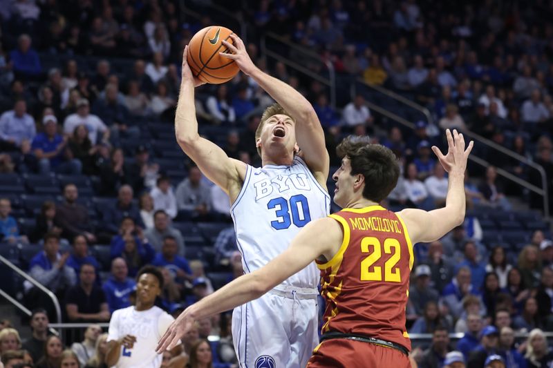 Jan 16, 2024; Provo, Utah, USA; Brigham Young Cougars guard Dallin Hall (30) goes to the basket against Iowa State Cyclones forward Milan Momcilovic (22) during the first half at Marriott Center. Mandatory Credit: Rob Gray-USA TODAY Sports