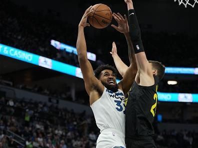 MINNEAPOLIS, MN -  NOVEMBER 30 :  Karl-Anthony Towns #32 of the Minnesota Timberwolves drives to the basket during the game against the Utah Jazz on November 30, 2023 at Target Center in Minneapolis, Minnesota. NOTE TO USER: User expressly acknowledges and agrees that, by downloading and or using this Photograph, user is consenting to the terms and conditions of the Getty Images License Agreement. Mandatory Copyright Notice: Copyright 2023 NBAE (Photo by Jordan Johnson/NBAE via Getty Images)