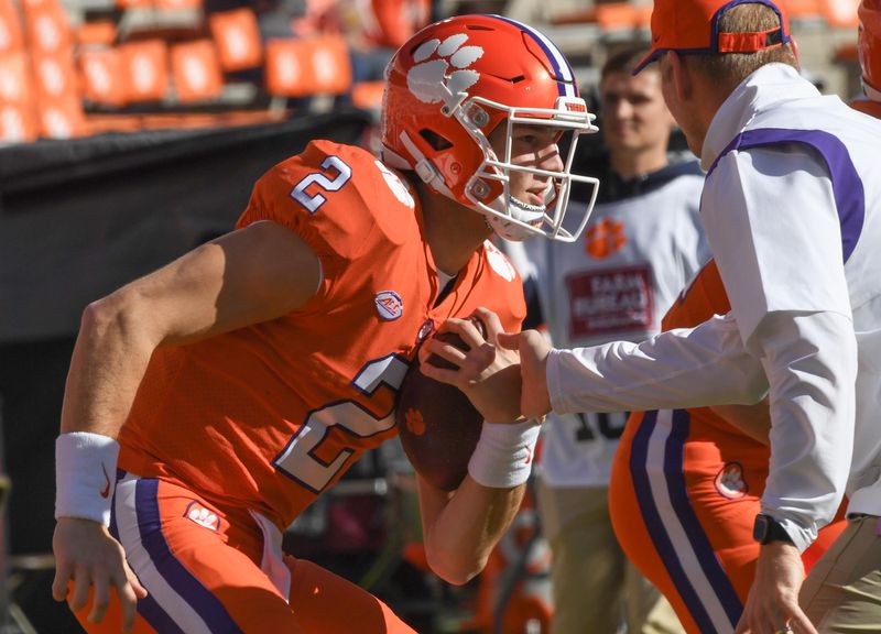 Nov 26, 2022; Clemson, SC, USA; Clemson quarterback Cade Klubnik (2) warms up with Clemson offensive coordinator Brandon Streeter before the game between South Carolina and Clemson at Memorial Stadium in Clemson, S.C. Saturday, Nov. 26, 2022.    Mandatory Credit: Ken Ruinard-USA TODAY Sports