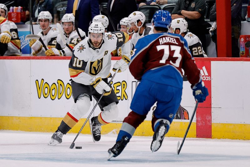 Sep 25, 2023; Denver, Colorado, USA; Vegas Golden Knights center Nicolas Roy (10) controls the puck against Colorado Avalanche defender Jeremy Hanzel (73) in the first period at Ball Arena. Mandatory Credit: Isaiah J. Downing-USA TODAY Sports