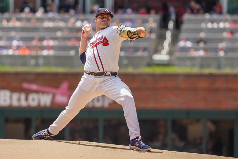 Apr 26, 2024; Cumberland, Georgia, USA; Atlanta Braves starting pitcher Bryce Elder (55) pitches against the Cleveland Guardians during the first inning at Truist Park. Mandatory Credit: Dale Zanine-USA TODAY Sports