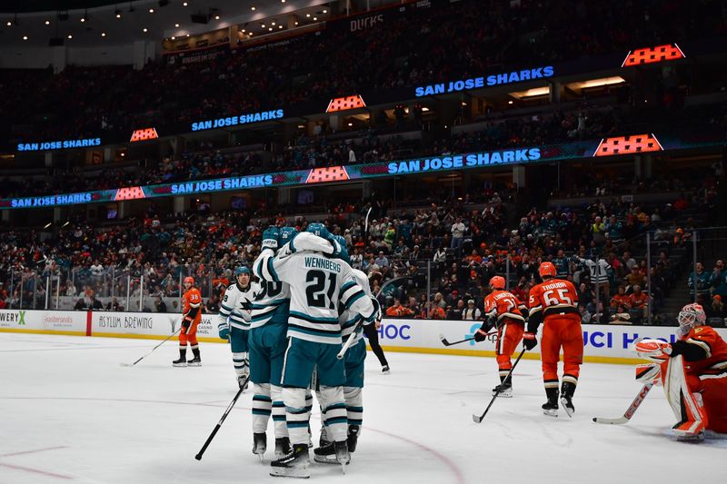 Apr 1, 2025; Anaheim, California, USA; San Jose Sharks celebrate the goal scored by center Alexander Wennberg (21) against the Anaheim Ducks during the third period at Honda Center. Mandatory Credit: Gary A. Vasquez-Imagn Images