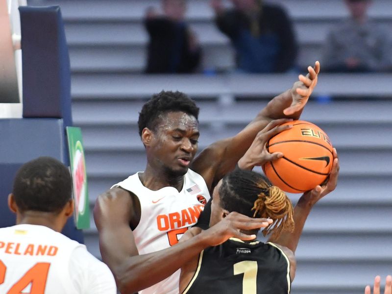 Dec 6, 2022; Syracuse, New York, USA; Syracuse Orange center Mounir Hima (55) fouls Oakland Golden Grizzlies forward Keaton Hervey (1) in the second half at JMA Wireless Dome. Mandatory Credit: Mark Konezny-USA TODAY Sports