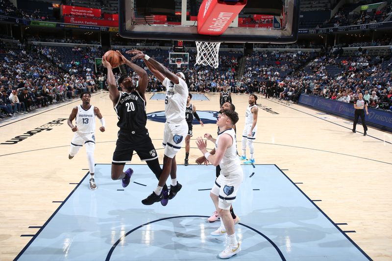 MEMPHIS, TN - February 26:  Day'Ron Sharpe #20 of the Brooklyn Nets drives to the basket during the game against the Memphis Grizzlies on February 26, 2024 at FedExForum in Memphis, Tennessee. NOTE TO USER: User expressly acknowledges and agrees that, by downloading and or using this photograph, User is consenting to the terms and conditions of the Getty Images License Agreement. Mandatory Copyright Notice: Copyright 2024 NBAE (Photo by Joe Murphy/NBAE via Getty Images)