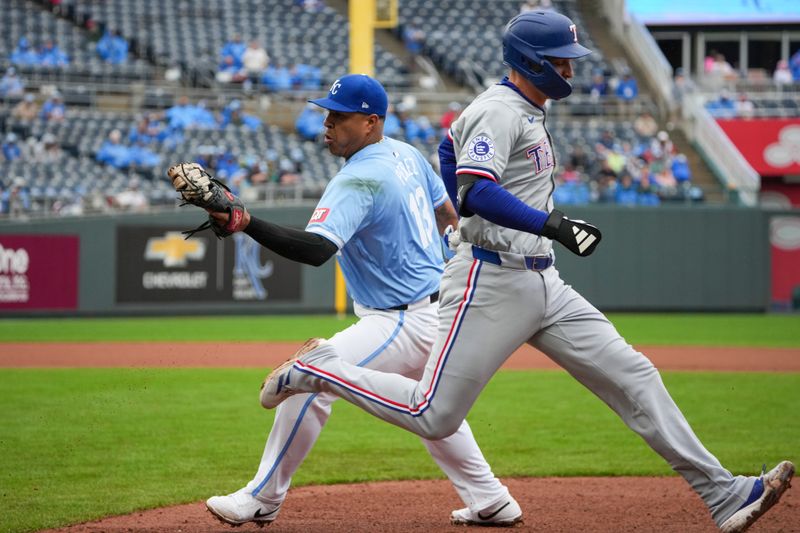 May 5, 2024; Kansas City, Missouri, USA; Kansas City Royals designated hitter Salvador Perez (13) can’t make the tag on Texas Rangers designated hitter Corey Seager (5) at first base in the ninth inning at Kauffman Stadium. Mandatory Credit: Denny Medley-USA TODAY Sports