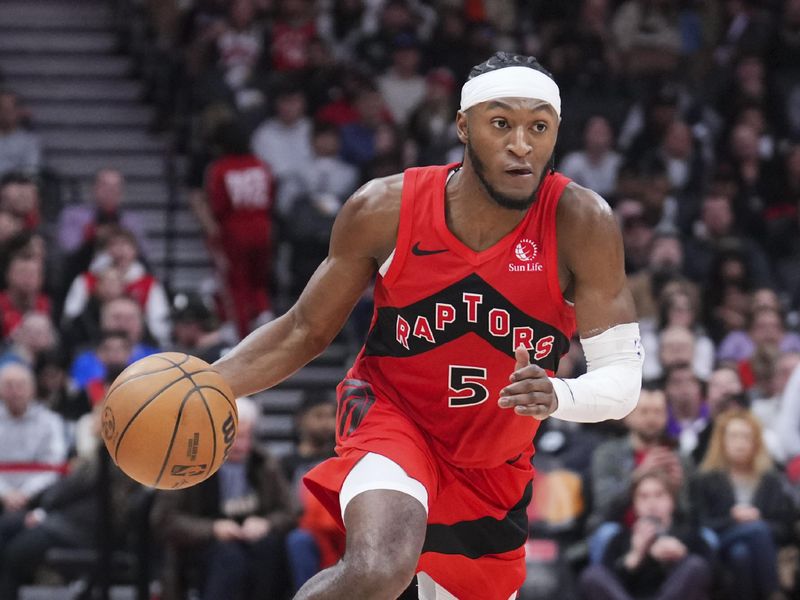 TORONTO, ON - JANUARY 1: Immanuel Quickley #5 of the Toronto Raptors dribbles against the Brooklyn Nets during the second half of their basketball game at the Scotiabank Arena on January 1, 2025 in Toronto, Ontario, Canada. NOTE TO USER: User expressly acknowledges and agrees that, by downloading and/or using this Photograph, user is consenting to the terms and conditions of the Getty Images License Agreement. (Photo by Mark Blinch/Getty Images)