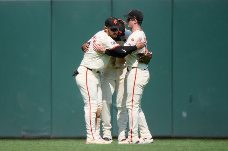 Jul 28, 2024; San Francisco, California, USA; San Francisco Giants outfielders Michael Conforto (8) (left), Derek Hill (48) (center) and Mike Yastrzemski (5) celebrate after the final out of the game against the Colorado Rockies during the ninth inning at Oracle Park. Mandatory Credit: Robert Edwards-USA TODAY Sports