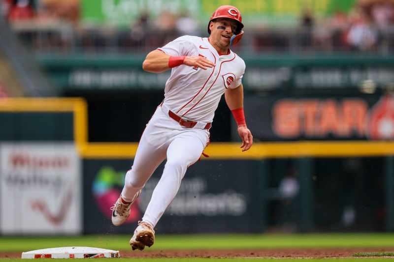 Jun 23, 2024; Cincinnati, Ohio, USA; Cincinnati Reds outfielder Spencer Steer (7) scores on a RBI double hit by catcher Tyler Stephenson (not pictured) in the sixth inning against the Boston Red Sox at Great American Ball Park. Mandatory Credit: Katie Stratman-USA TODAY Sports