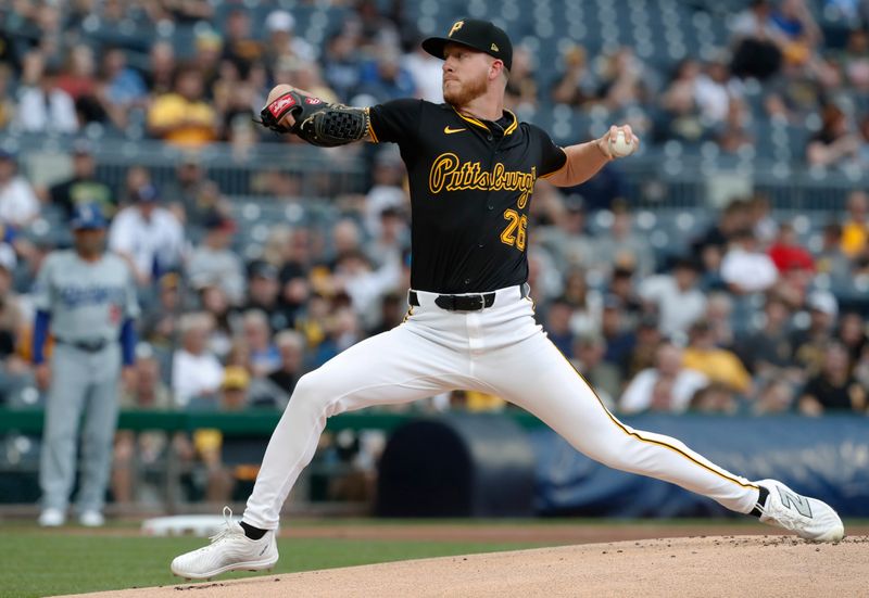 Jun 6, 2024; Pittsburgh, Pennsylvania, USA;  Pittsburgh Pirates starting pitcher Bailey Falter (26) delivers a pitch against the Los Angeles Dodgers during the first inning at PNC Park. Mandatory Credit: Charles LeClaire-USA TODAY Sports