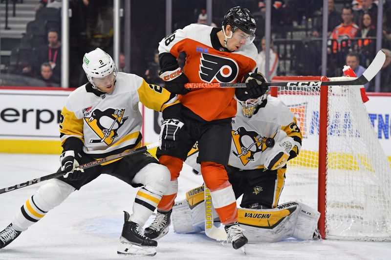 Jan 8, 2024; Philadelphia, Pennsylvania, USA; Philadelphia Flyers center Morgan Frost (48) battles with Pittsburgh Penguins defenseman Chad Ruhwedel (2) as he screens goaltender Alex Nedeljkovic (39) while making save during the first period at Wells Fargo Center. Mandatory Credit: Eric Hartline-USA TODAY Sports