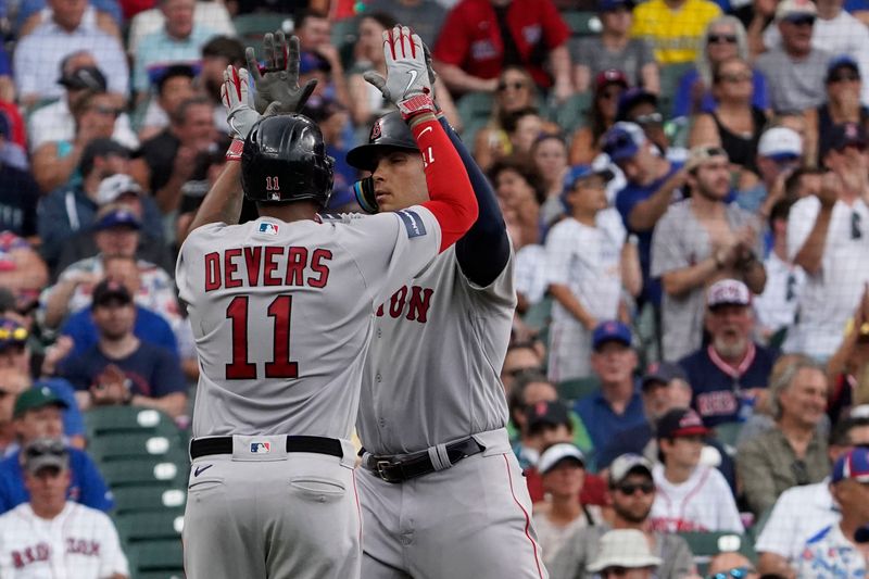 Jul 15, 2023; Chicago, Illinois, USA; Boston Red Sox first baseman Triston Casas (36) is greeted by  third baseman Rafael Devers (11) after hitting a two-run home run against the Chicago Cubs during the seventh inning at Wrigley Field. Mandatory Credit: David Banks-USA TODAY Sports