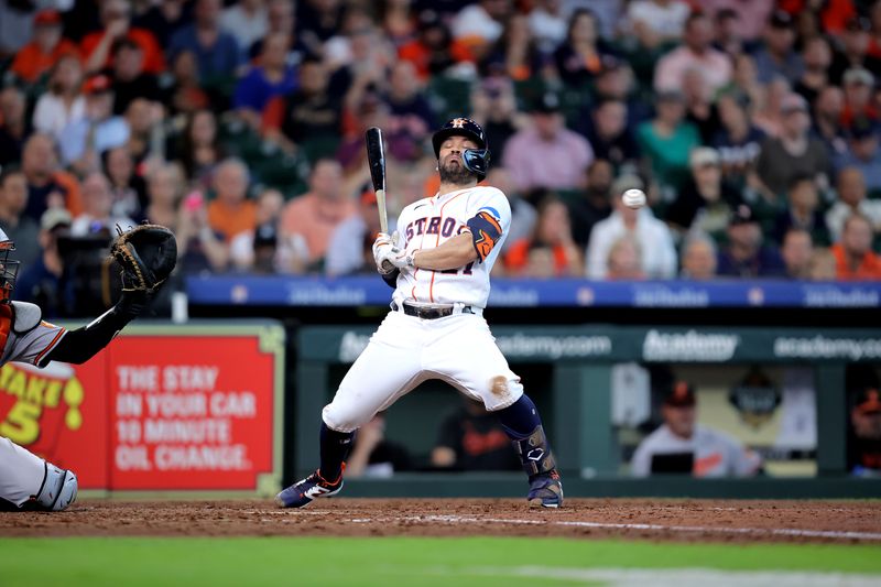 Sep 20, 2023; Houston, Texas, USA; Houston Astros second baseman Jose Altuve (27) avoids an inside pitch thrown by Baltimore Orioles relief pitcher Shintaro Fujinami (14, not shown) during the eighth inning at Minute Maid Park. Mandatory Credit: Erik Williams-USA TODAY Sports
