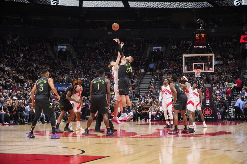 TORONTO, CANADA - MARCH 5:  Opening tip-off between Jonas Valanciunas #17 of the New Orleans Pelicans & Kelly Olynyk #41 of the Toronto Raptor on March 5, 2024 at the Scotiabank Arena in Toronto, Ontario, Canada.  NOTE TO USER: User expressly acknowledges and agrees that, by downloading and or using this Photograph, user is consenting to the terms and conditions of the Getty Images License Agreement.  Mandatory Copyright Notice: Copyright 2024 NBAE (Photo by Mark Blinch/NBAE via Getty Images)