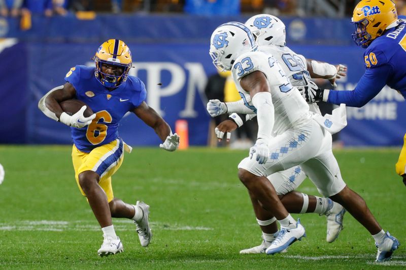 Sep 23, 2023; Pittsburgh, Pennsylvania, USA; Pittsburgh Panthers running back Rodney Hammond Jr. (6) runs the ball against the North Carolina Tar Heels during the first quarter at Acrisure Stadium. Mandatory Credit: Charles LeClaire-USA TODAY Sports